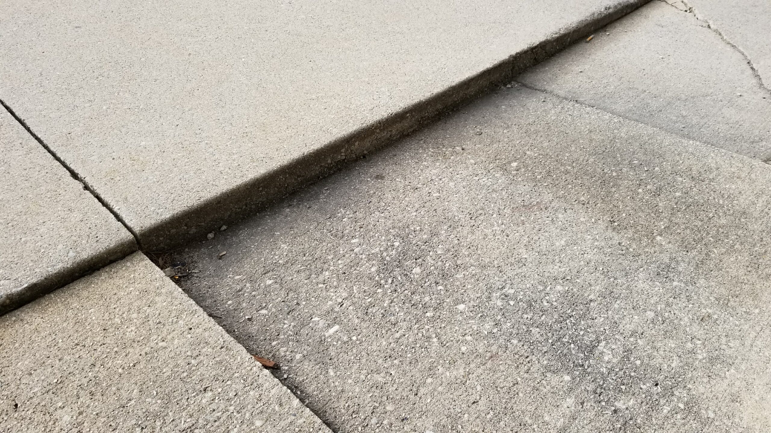 This concrete slab has experienced significant settlement.