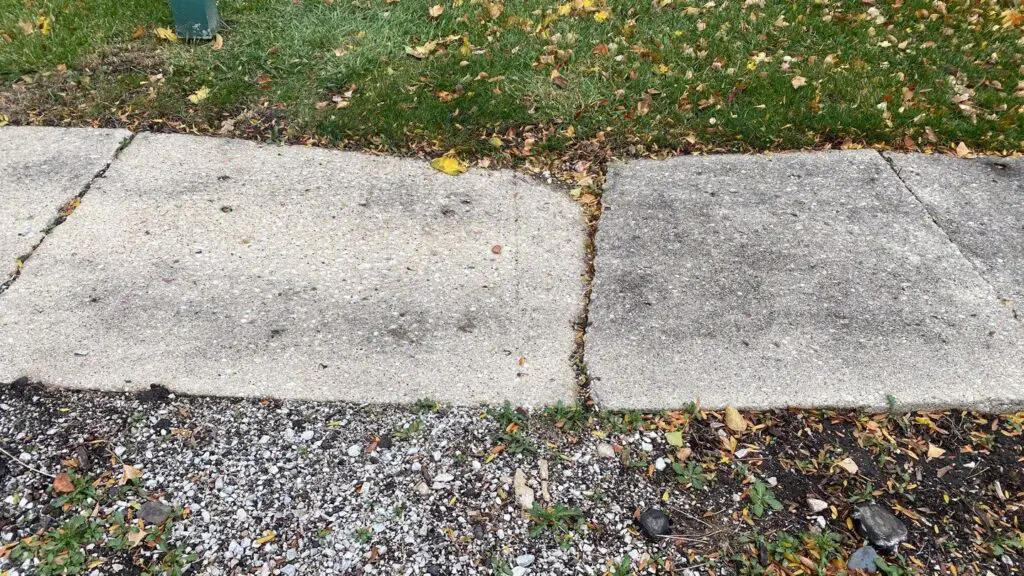 An image of a damaged sidewalk that could be repaired with PolyPier.