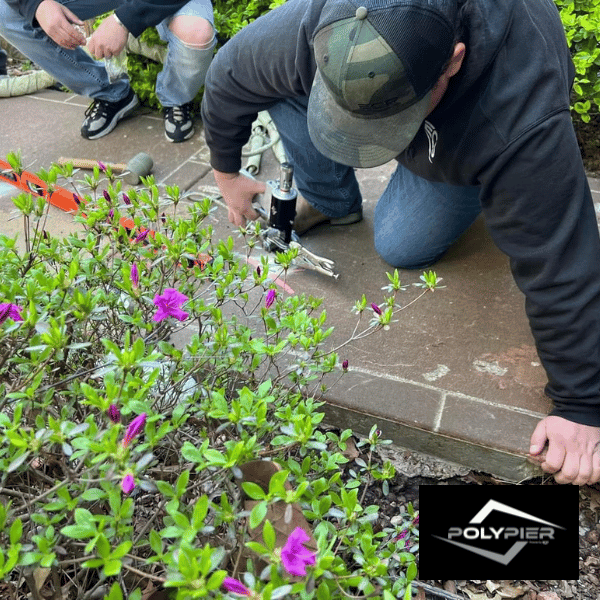 Installer showing class attendees how to add concrete lifting to their business.